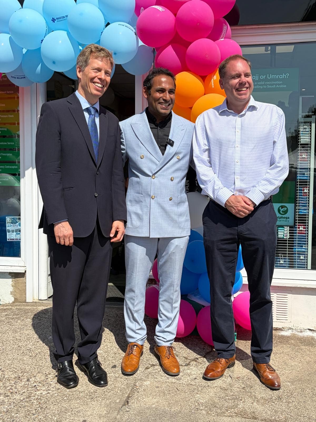 Charlie Dewhirst MP, Jaya and Prince Alexander von Liechtenstein outside Marton Road Pharmacy on open day